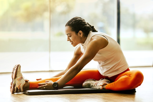 Photo by Jonathan Borba: https://www.pexels.com/photo/woman-stretching-on-ground-3076509/ Trending new exercise programs